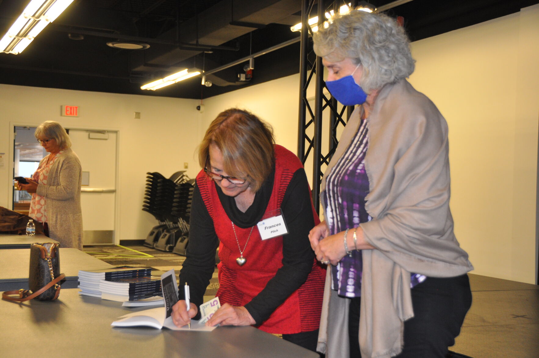 pilch signs the book.JPG